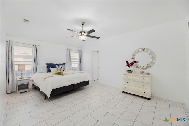 bedroom featuring vaulted ceiling and ceiling fan