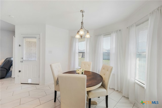 dining space featuring a chandelier