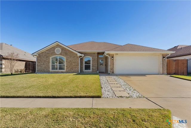 single story home with a garage and a front yard