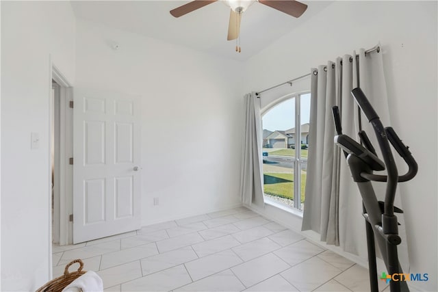 interior space featuring ceiling fan
