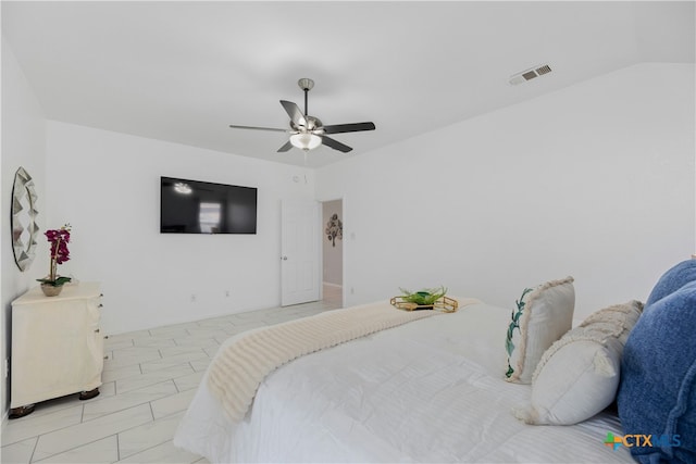 bedroom featuring ceiling fan and lofted ceiling