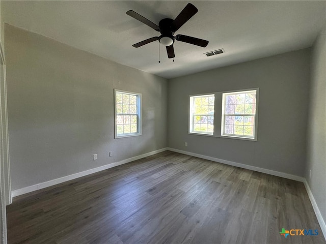 unfurnished room with ceiling fan and wood-type flooring