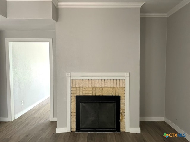 details with crown molding, a fireplace, and hardwood / wood-style flooring