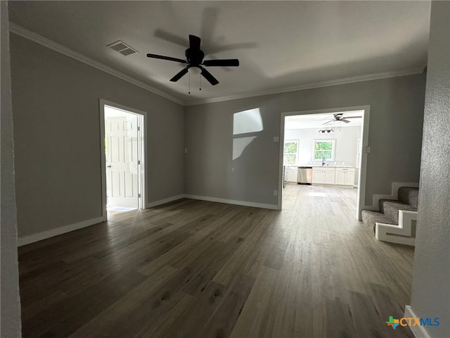 spare room with dark hardwood / wood-style flooring, ceiling fan, crown molding, and sink