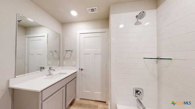 4023 Illian Cv, Killeen, TX 76542 - bathroom featuring vanity, wood finished floors, and shower / washtub combination
