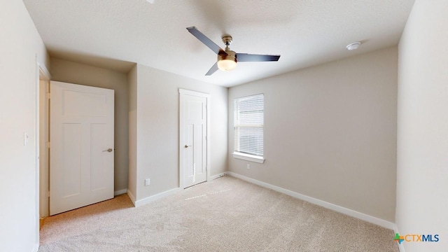 4023 Illian Cv, Killeen, TX 76542 - unfurnished bedroom with light carpet, baseboards, a closet, and ceiling fan