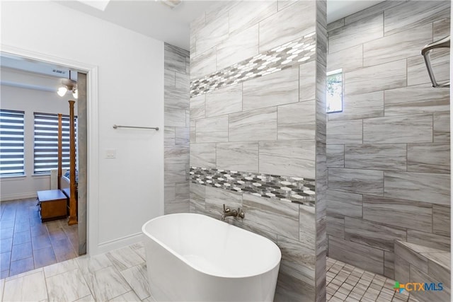 34784 High Gate Rd, Bulverde, TX 78163 - bathroom featuring a freestanding tub, healthy amount of natural light, and a tile shower