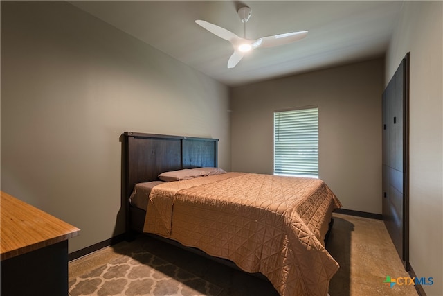 carpeted bedroom featuring ceiling fan