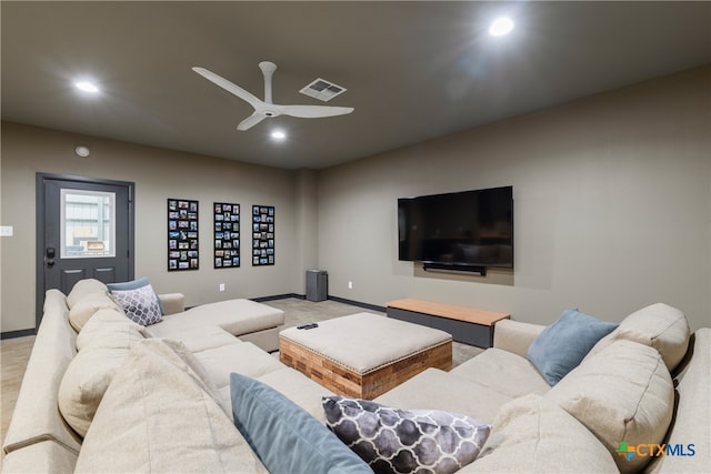 living room featuring ceiling fan and carpet floors