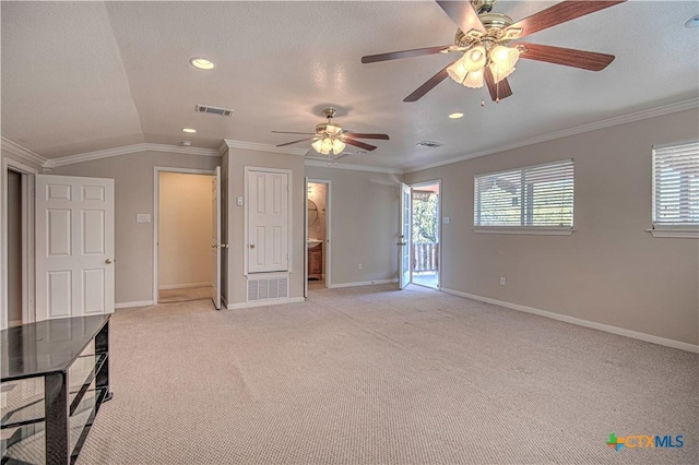 interior space with visible vents, crown molding, light carpet, and baseboards