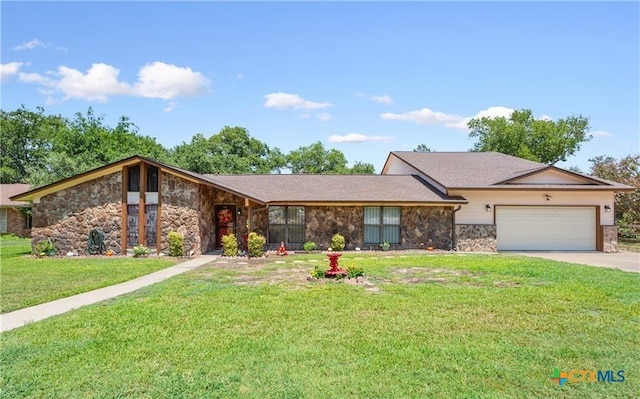 view of front of property with a garage, concrete driveway, a front lawn, and stone siding