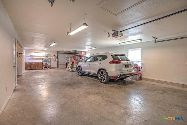 garage featuring baseboards and a garage door opener