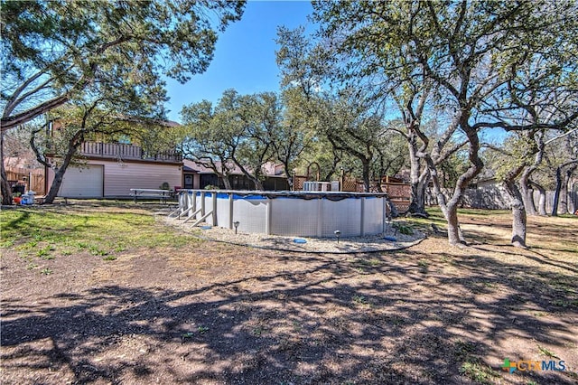 view of yard with an outdoor pool