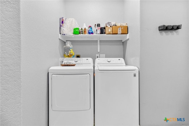 laundry area featuring laundry area and washer and clothes dryer