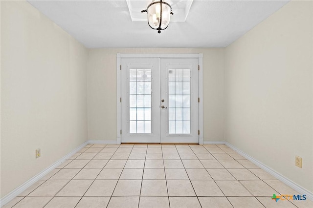 entryway with french doors and baseboards