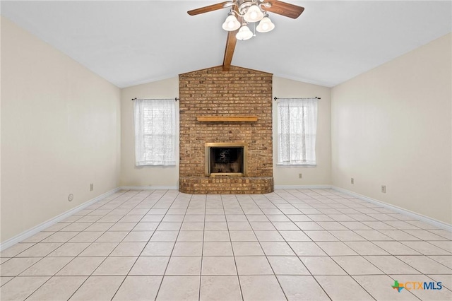 unfurnished living room with plenty of natural light, ceiling fan, a brick fireplace, and vaulted ceiling with beams