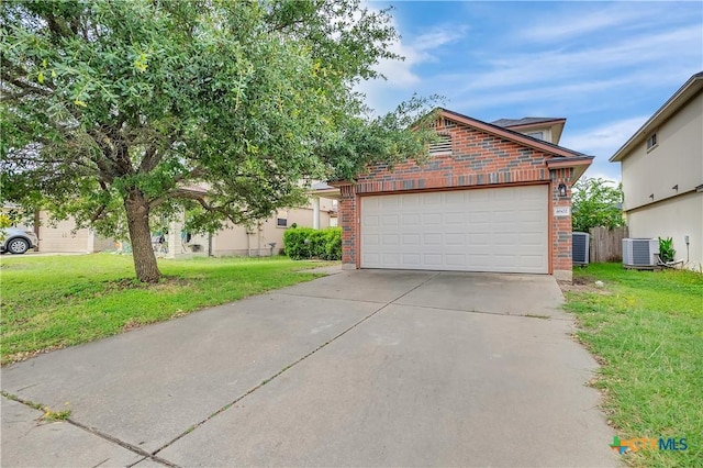 4602 Causeway Ct, Killeen, TX 76549 - view of front of home with brick siding, central AC, a front lawn, and driveway