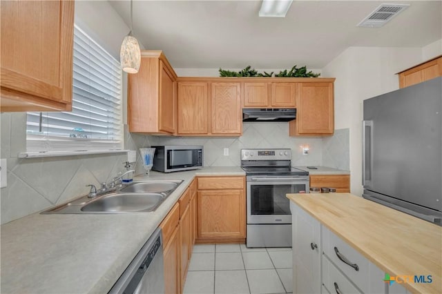 4602 Causeway Ct, Killeen, TX 76549 - kitchen featuring stainless steel appliances, extractor fan, a sink, and decorative backsplash