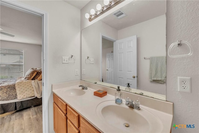 4602 Causeway Ct, Killeen, TX 76549 - ensuite bathroom featuring wood finished floors and double vanity