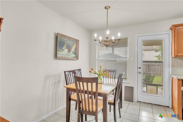 4602 Causeway Ct, Killeen, TX 76549 - dining area featuring a chandelier, light tile patterned floors, and baseboards