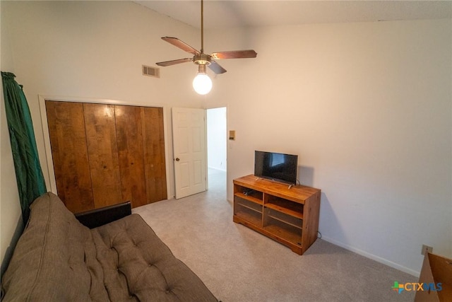 living room featuring light carpet, high vaulted ceiling, and ceiling fan