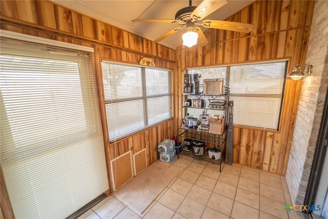 interior space with ceiling fan