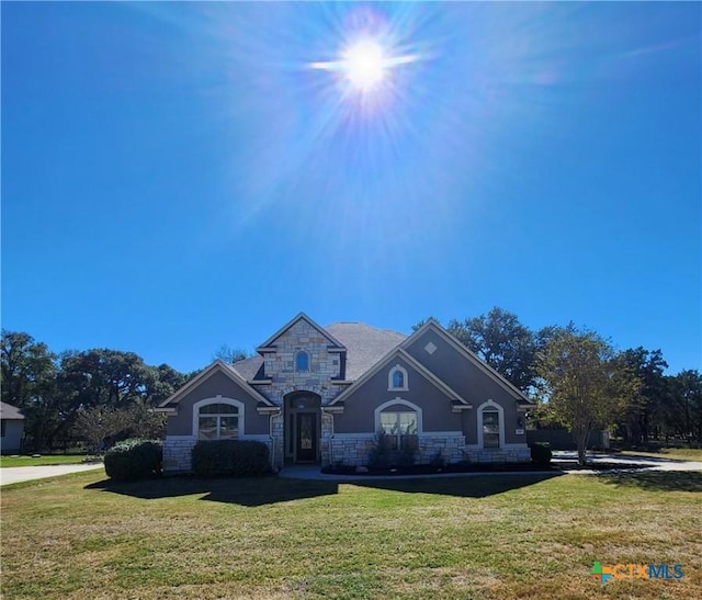 555 Solms Frst, New Braunfels, TX 78132 - french country inspired facade with stone siding, a front yard, and stucco siding