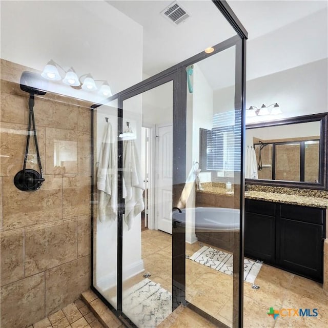 555 Solms Frst, New Braunfels, TX 78132 - full bathroom featuring a stall shower, vanity, a garden tub, and tile patterned floors
