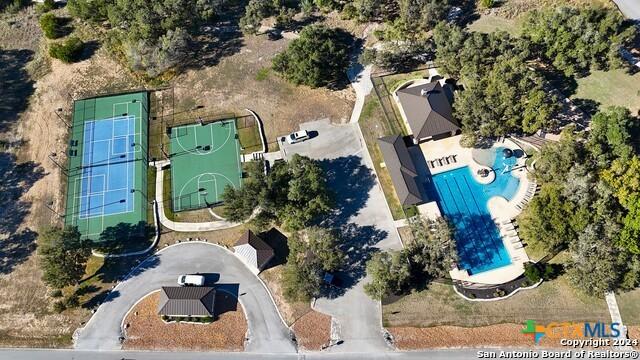 555 Solms Frst, New Braunfels, TX 78132 - aerial view of property and surrounding area featuring a pool area