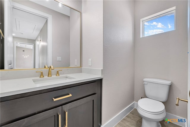 bathroom featuring hardwood / wood-style floors, vanity, and toilet