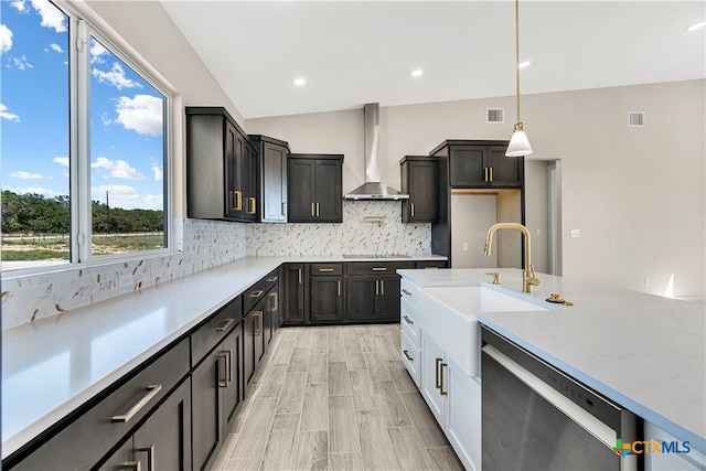 kitchen featuring wall chimney range hood, vaulted ceiling, white cabinets, stainless steel dishwasher, and black electric cooktop