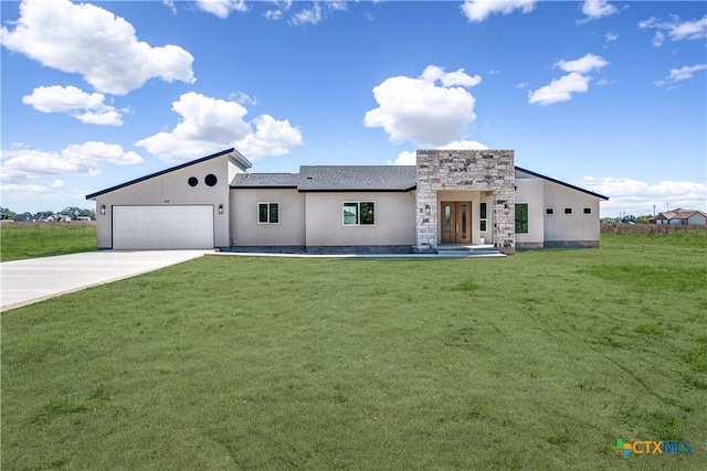 view of front facade featuring a garage and a front yard