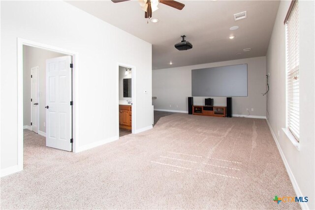 2241 Berger Rd, Temple, TX 76501 - cinema room featuring light colored carpet, ceiling fan, baseboards, and recessed lighting