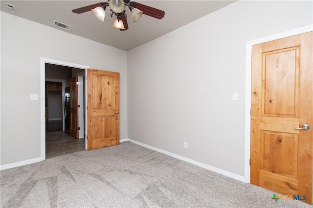 2241 Berger Rd, Temple, TX 76501 - unfurnished bedroom featuring carpet floors, baseboards, and ceiling fan