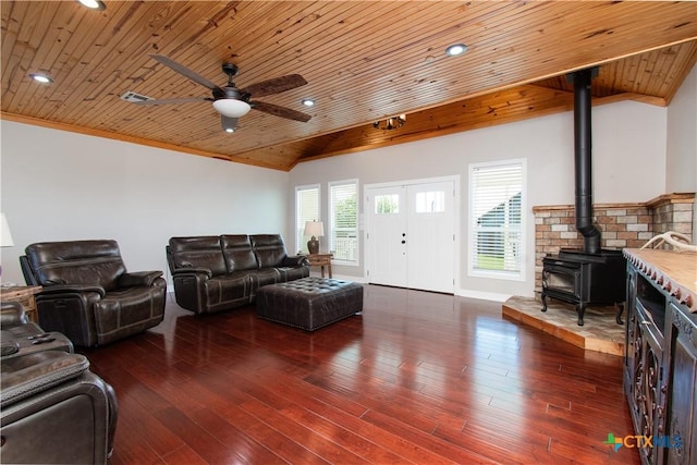 2241 Berger Rd, Temple, TX 76501 - living area with wood ceiling, a ceiling fan, a wood stove, vaulted ceiling, and wood finished floors