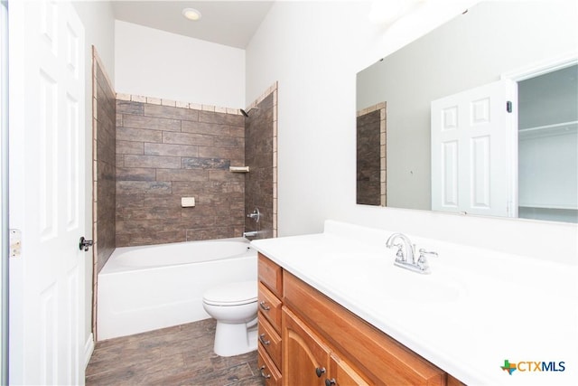 2241 Berger Rd, Temple, TX 76501 - bathroom with wood finished floors, toilet, vanity, and shower / washtub combination