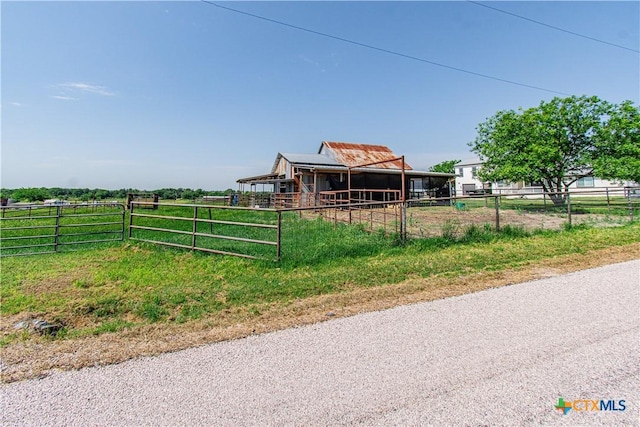 2241 Berger Rd, Temple, TX 76501 - view of front of property with an exterior structure, an outdoor structure, and a rural view