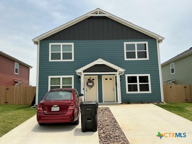 1007 S 26th St, Temple, TX 76501 - view of front facade featuring driveway and board and batten siding