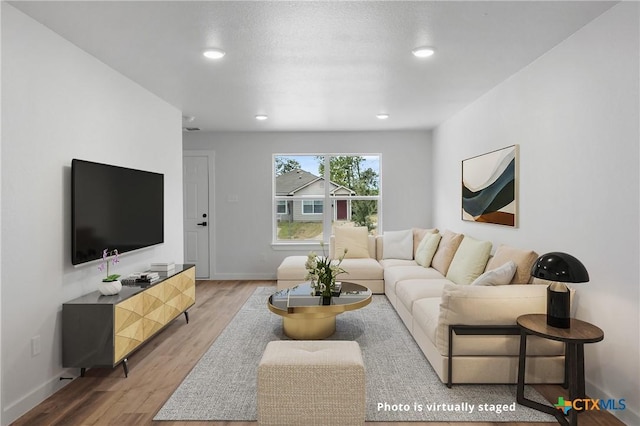 1007 S 26th St, Temple, TX 76501 - living area with light wood-type flooring, baseboards, and recessed lighting