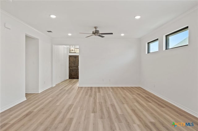 unfurnished room with crown molding, light hardwood / wood-style flooring, and ceiling fan