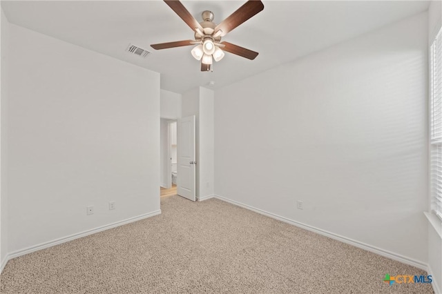 unfurnished room featuring light carpet and ceiling fan