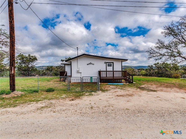 view of property exterior with a deck