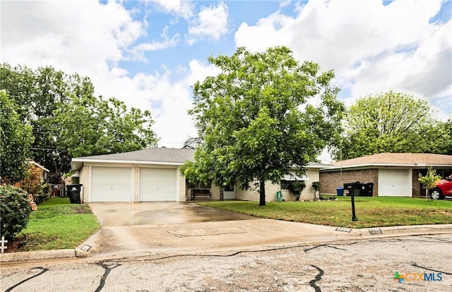 3206 Shady Hill Dr, Temple, TX 76502 - view of front facade featuring brick siding, a front lawn, driveway, and a garage
