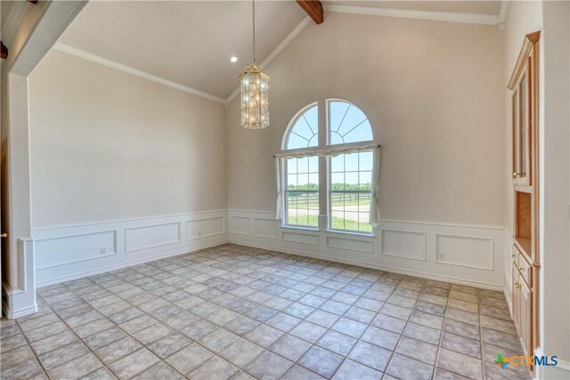 1041 Clarence Rd, Temple, TX 76501 - empty room featuring beamed ceiling, a wainscoted wall, high vaulted ceiling, and a chandelier