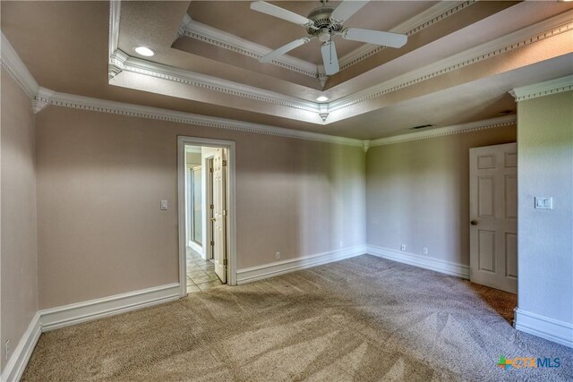 1041 Clarence Rd, Temple, TX 76501 - empty room featuring baseboards, a ceiling fan, ornamental molding, carpet floors, and a raised ceiling