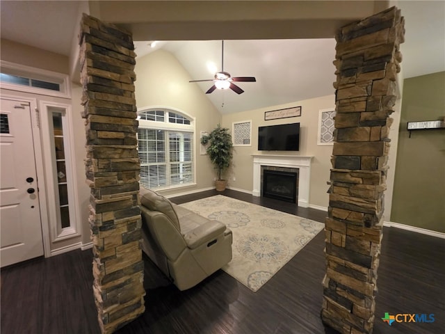 102 Lexington Ln, Victoria, TX 77901 - living area featuring ornate columns, lofted ceiling, ceiling fan, a fireplace, and dark wood-style floors