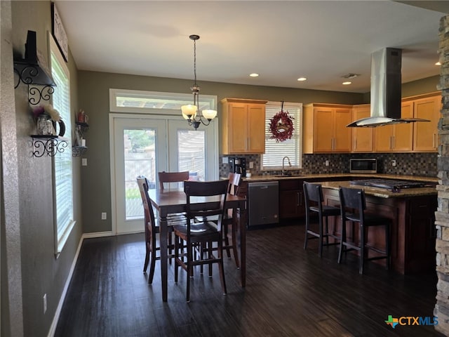102 Lexington Ln, Victoria, TX 77901 - dining room featuring dark wood-type flooring, baseboards, recessed lighting, and a chandelier