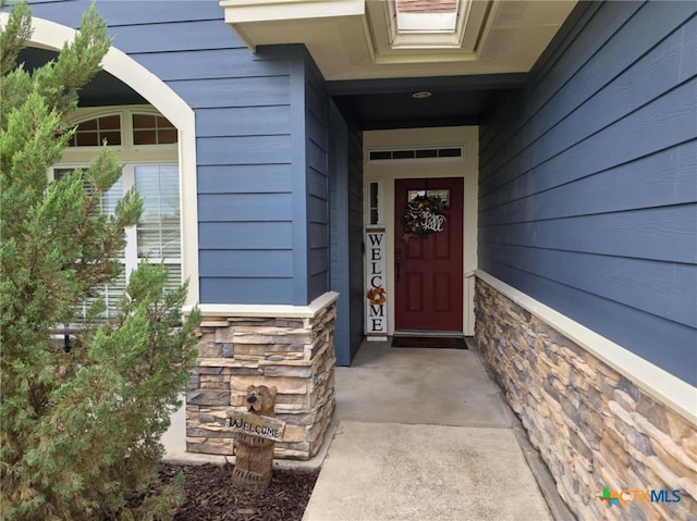 102 Lexington Ln, Victoria, TX 77901 - doorway to property featuring stone siding