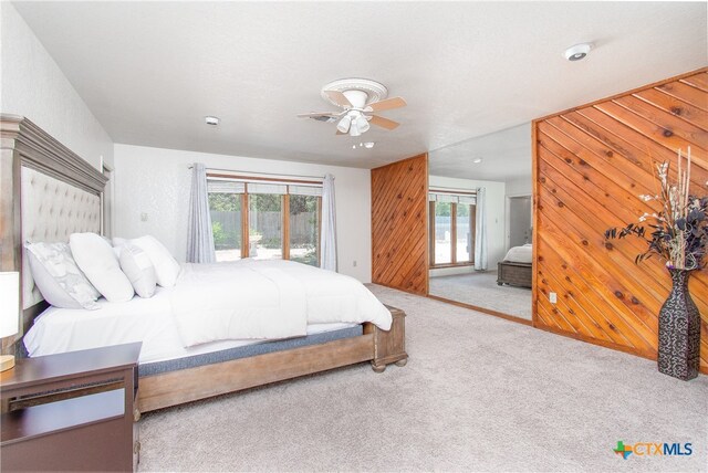 bedroom with access to outside, carpet flooring, and ceiling fan