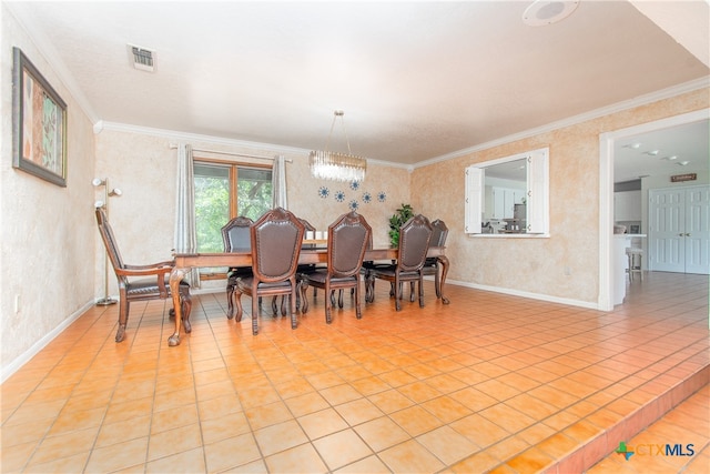 tiled dining area with an inviting chandelier and crown molding